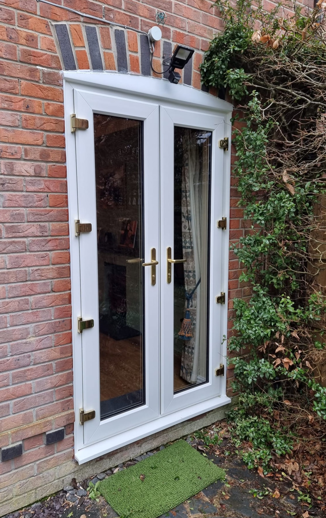 White French Doors with gold accessories