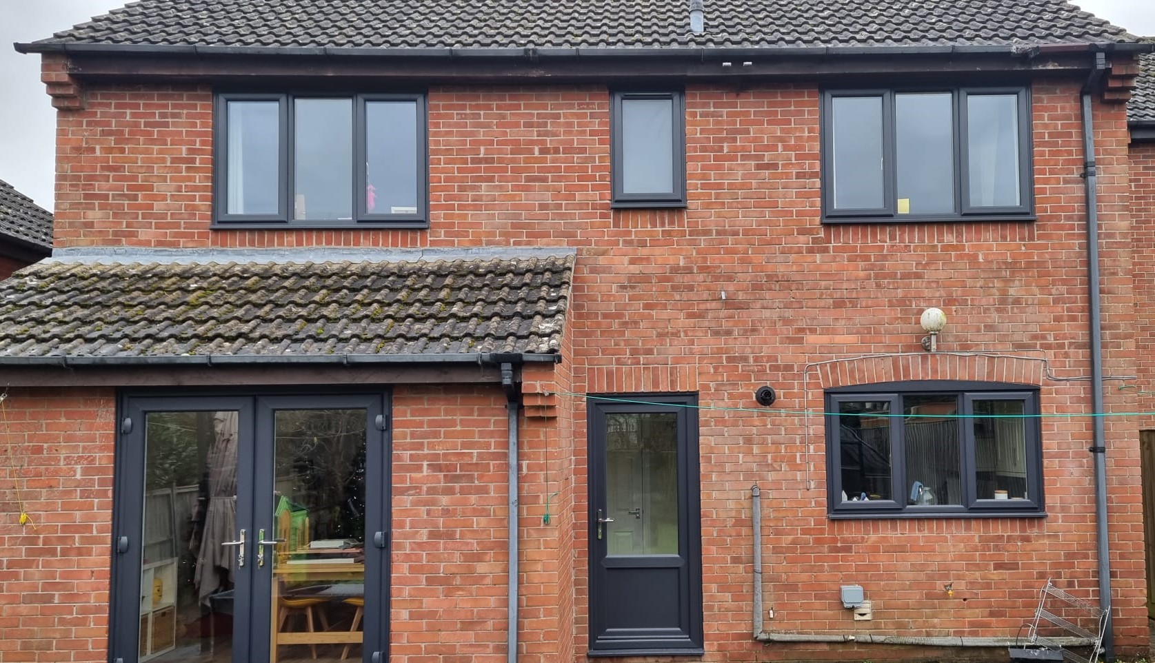 4 anthracite grey windows, 1 anthracite grey PVC door, 1 anthracite grey french doors