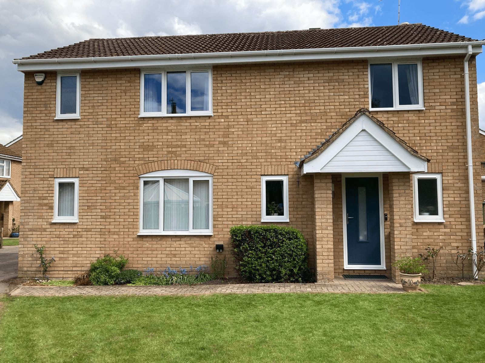 8 white uPVC windows and 1 Composite Front Door